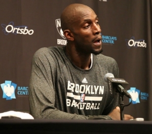 Brooklyn Nets forward Kevin Garnett talking with the media postgame
