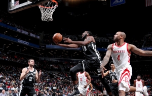 Brooklyn Nets forward DeMarre Carroll takes the ball to the hole while Houston Rockets forward PJ Tucker looks on in a game at the Barclays Center on Tuesday, February 6, 2018