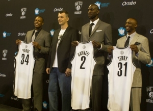 Photo (l to r): Paul Pierce, Brooklyn Nets owner, Mikhail Prokhorov; Kevin Garnett, and Jason Terry