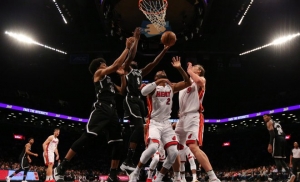 DeMarre Carroll (2nd from left) fights for rebound against Miami Heat  