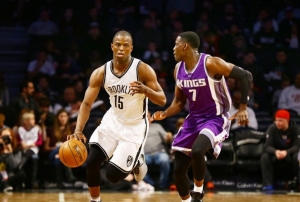 Brooklyn Nets Isaiah Whitehead dribbles past Sacramento&#039;s Darren Collison in game on November 27, 2016