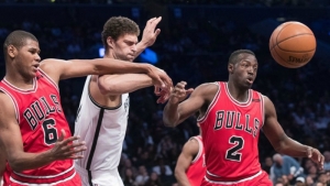 In a rough and tumble game, Brook Lopez (center), Chicago Bulls forward Cristiano Felicio (6) and guard Jerian Grant (2) battle for the ball on Saturday, April 8, 2017, the Nets last home game of the 2016-17 NBA season. The Nets beat the Bulls 107-106.  