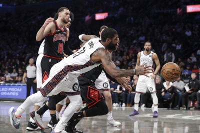Kyrie Irving, Brooklyn Nets guard, scrambles for the ball, scores 54 points in Nets 133-118 victory over Chicago Bulls
