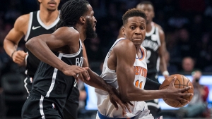Brooklyn Nets forward DeMarre Carroll (left) trying to stop NY Knicks rookie guard Frank Ntilikina