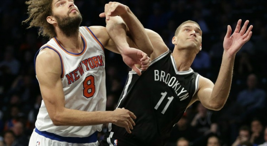 Brooklyn Nets center Brook Lopez muscling out his twin brother New York Knicks center Robin Lopez 