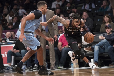 Brooklyn Nets guard D’Angelo Russell moving past a Memphis Grizzlies’ defender
