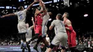 Brooklyn Nets guard Caris LeVert  attempting to block shot by Toronto Raptors guard DeMar DeRozan (10) on January 17, 2017