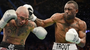 Miguel Cotto (l) receives his first boxing loss at Madison Square garden at the hands of Austin Trout.