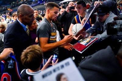 Golden State Warriors guard Stephen Curry signing autographs for fans prior to  game with the Brooklyn Nets at the Barclays Center on December 6, 2015