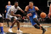 Brooklyn Nets rookie Caris Levert guarding Oklahoma City Thunder's Russell Westbrook during a game at the Barclays Center on March 14, 2017