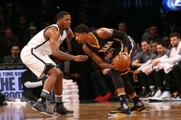 Brooklyn Nets forward Joe Johnson defending against Indiana Pacers forward Paul George