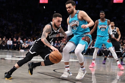 Chris Chiozza, a Brooklyn Nets two-way guard, holding off Memphis Grizzlies guard, Tyus Jones, at an NBA basketball game at the Barclays Center on Wednesday, March 4, 2020