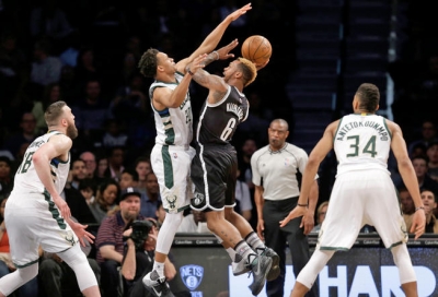 Nets guard Sean Kilpatrick (6) looks to pass around Bucks guard Rashad Vaughn during the first half of Nets meeting with Bucks on March 13, 2016. The Bucks defeated the Nets 109-100.