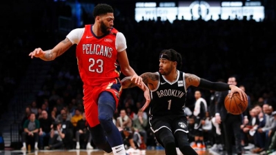 Brooklyn Nets guard D&#039;Angelo Russell pushing past New Orleans Pelicans forward Anthony Davis (23) at a game at the Barclays Center on January 2, 2019.