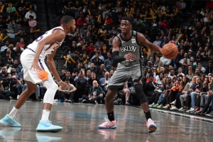 Brooklyn Nets guard Caris LeVert defending ball against Phoenix Suns forward Mikal Bridges on Monday, February 3, 2020, at the Barclays Center in Brooklyn, NY.