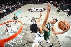 Brooklyn Nets center, Jarrett Allen, defending basket against Giannis Antetokounmpo of the Milwaukee Bucks on January 18, 2020, at the Barclays Center in Brooklyn