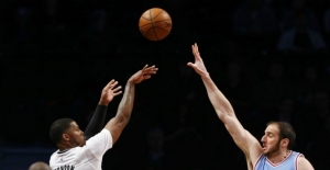 Brooklyn Nets forward Joe Johnson (7) shoots over Sacramento Kings center Kosta Koufos (41) during the first half at Barclays Center