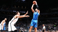 Brooklyn Nets center Brook Lopez putting up a valiant effort to defend against the Orlando Magic