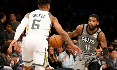 Brooklyn Nets guard Kyrie Irving with the ball, while Utah Jazz rookie guard/forward, Rayjon Tucker tries to defend in a game at the Barclays Center on Tuesday, January 14, 2010. The Brooklyn Nets lost to the Utah Jazz 118-107.  