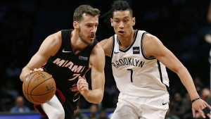 Brooklyn Nets guard Jeremy Lin guarding Miami Heat’s Goran Dragic(left). Nets defeat Heat 107-88