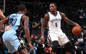 Brooklyn Nets shooting guard Sean Kilpatrick holding off Memphis Grizzlies shooting guard Troy Daniels at a game at the Barclays Center on February 13, 2017.