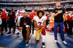 Colin Kaepernick kneeling during the National Anthem prior to a San Francisco 49ers game