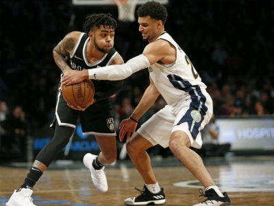 Brooklyn Nets guard D&#039;Angelo Russell (1) defending the ball against Denver Nuggets guard Jamal Murray (27)