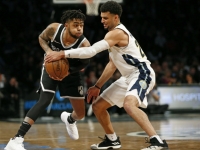 Brooklyn Nets guard D'Angelo Russell (1) defending the ball against Denver Nuggets guard Jamal Murray (27)
