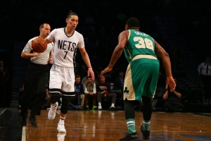 Nets guard Jeremy Lin bringing the ball up and being defended by Celtics guard Marcus Smart