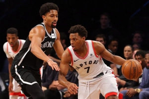 Brooklyn Nets point guard Spencer Dinwiddie guarding Kyle Lowry of Toronto Raptors at Barclays Center on January 8, 2018. 