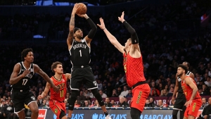 Brooklyn Nets guard D’Angelo Russell (center) shooting the ball over Alex Len (right) of the Atlanta Hawks