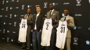 Photo from Left to Right: Paul Pierce, Mikhail Prokhorov, Brooklyn Nets Principal Owner; Kevin Garnett, and Jason Terry