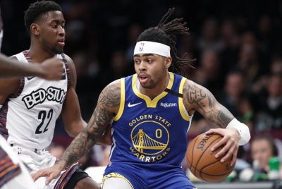 Golden State Warriors guard D’Angelo Russell (foreground) drives next to Brooklyn Nets guard Caris LeVert (22) during an NBA basketball game on Wednesday, February 5, 2020, at the Barclays Center in Brooklyn, New York. The Brooklyn Nets defeated the Golden State Warriors 129-88