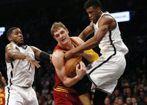 Photo: Thaddeus Young, Brooklyn Nets forward, tries to strip ball from Cleveland Cavaliers center Timofey Mozgov